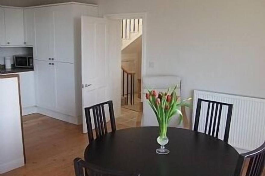 A seafront holiday home with panoramic views of Cowes Harbour and the Solent.