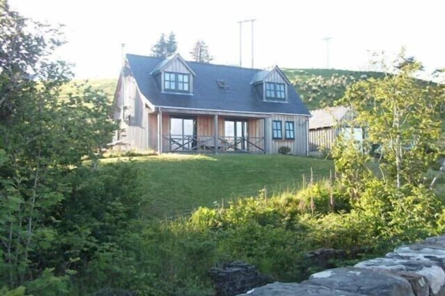 Charming property overlooking beach at Knock Bay and beyond to Knoydart