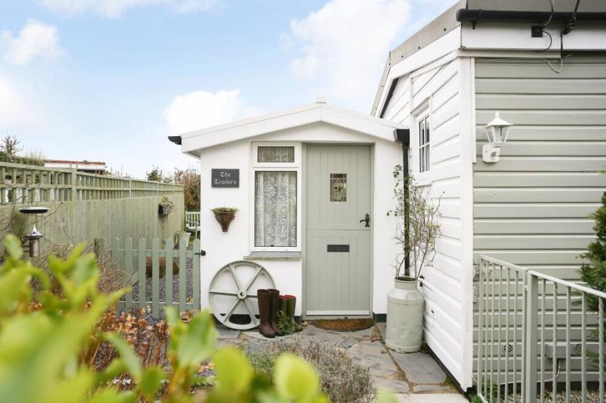 Quirky home with romantic shepherds' hut bedrooms and pretty garden near Padstow