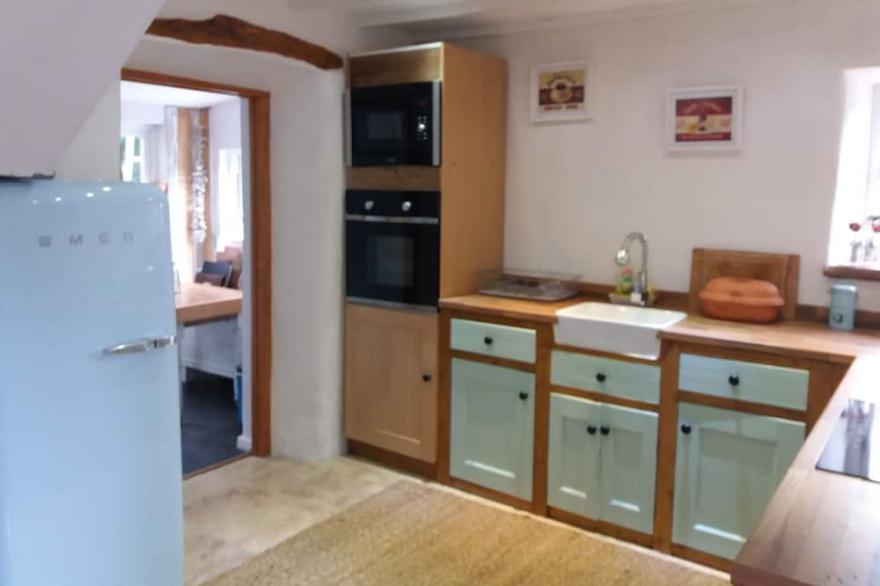 Lovely end of row character cottage with stunning views over the River Teifi