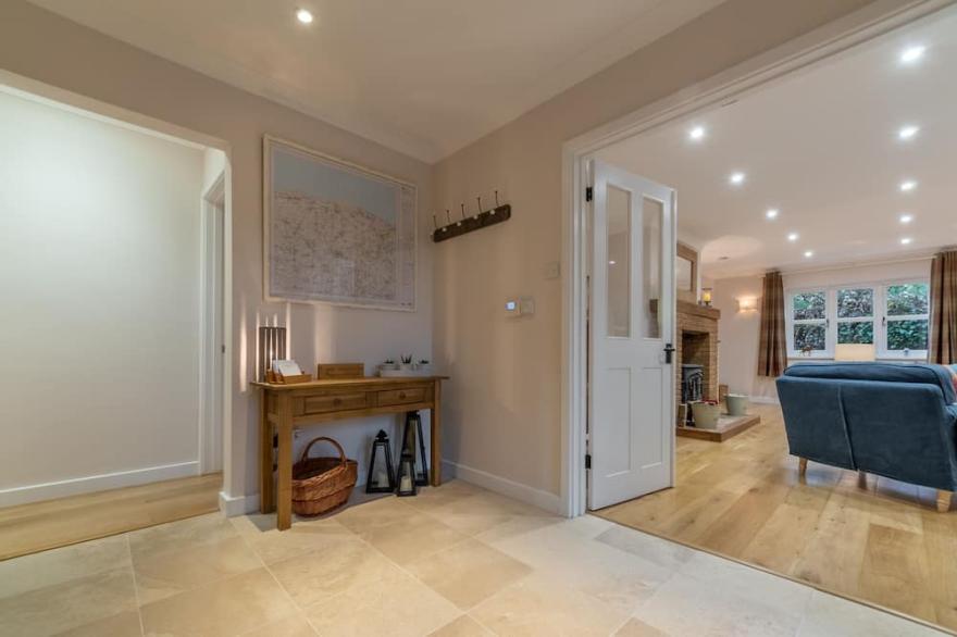 A beautiful flint fronted detached bungalow, set in glorious gardens