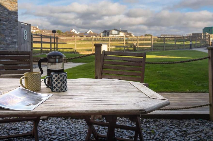 Contemporary 3 bedroom house within metres of the sandy beach
