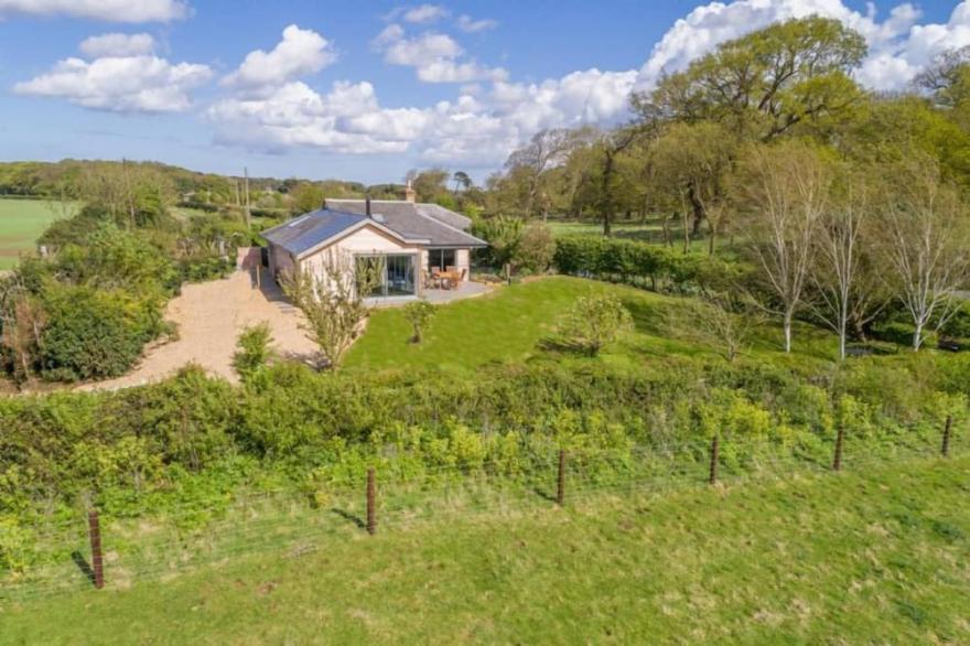 A superb, architecturally designed contemporary lodge in a spectacular location.