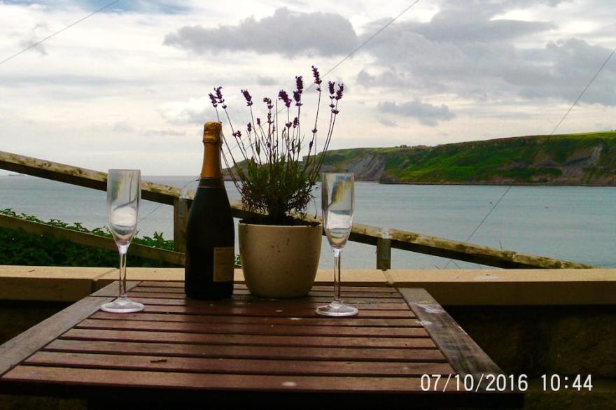 Situated in the heart of the village, within metres of the sea and sandy beach.