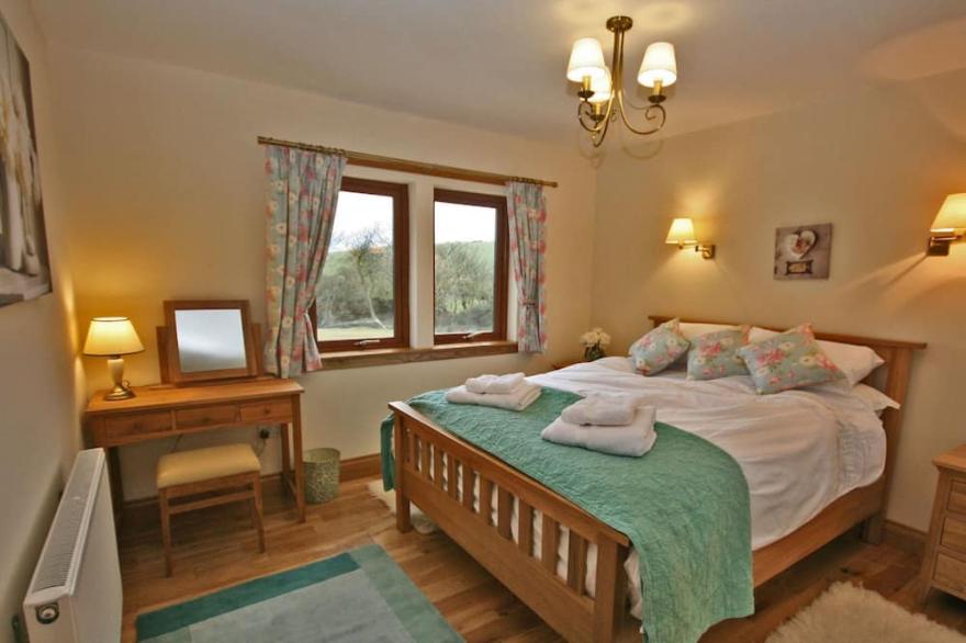 Luxury lodge situated idyllically on the edge of a small working farm