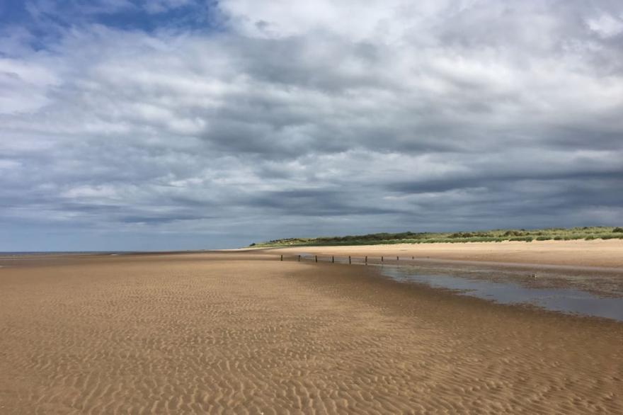 A beautifully presented four-bedroom holiday home near Holme Beach.
