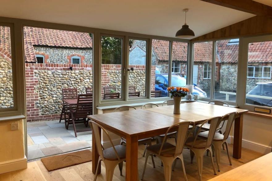 Half Moon House is a beautifully renovated brick and flint cottage near Wells.