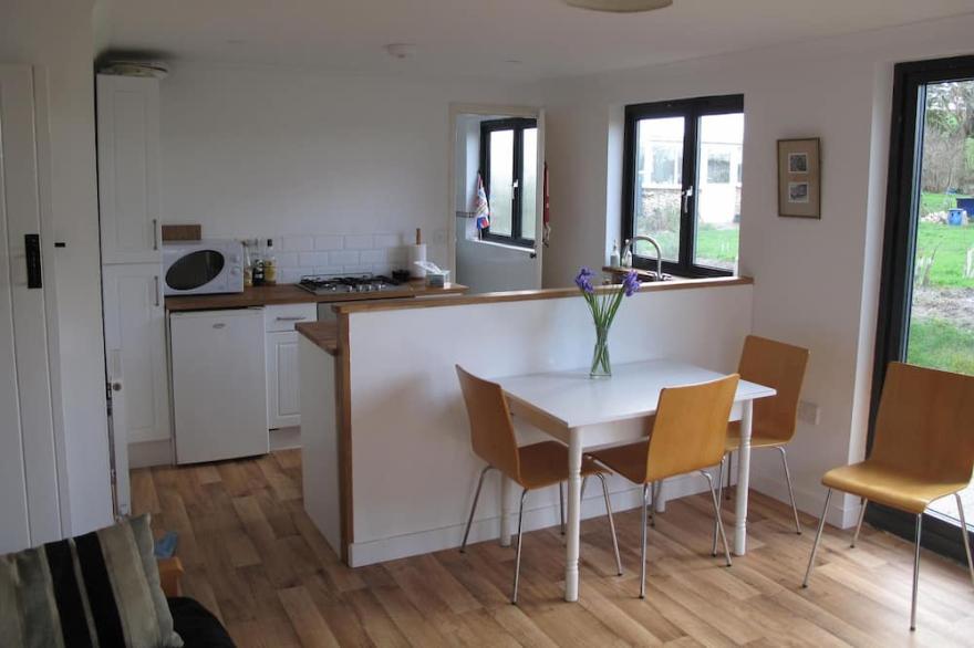 Cottage Set In Rolling Countryside