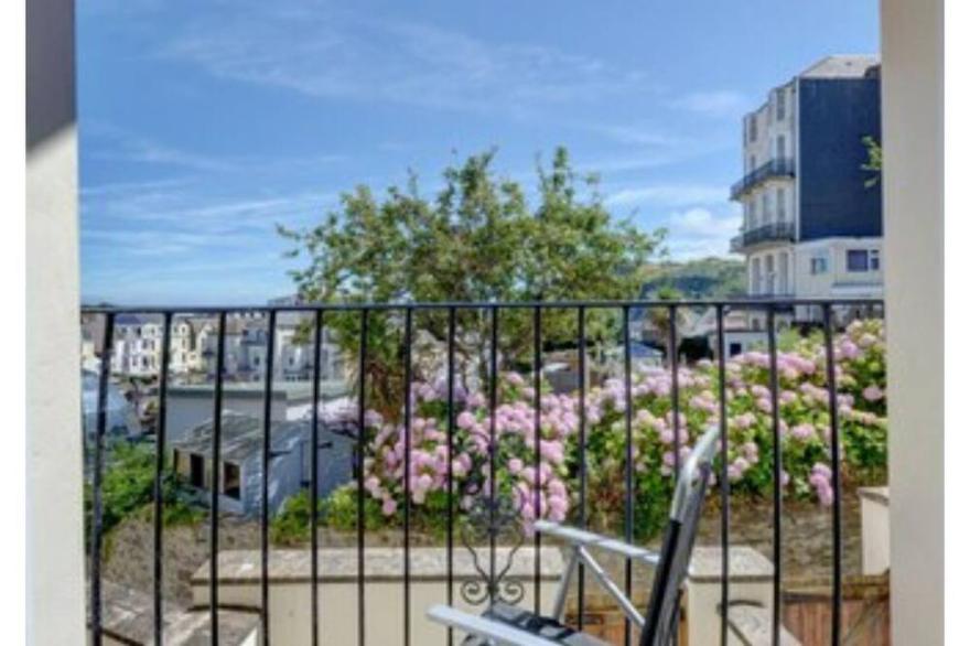 Spacious apartment with balcony views across the town and sea