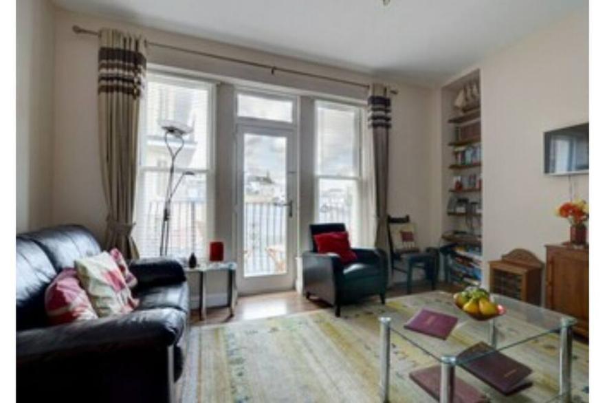 Spacious apartment with balcony views across the town and sea