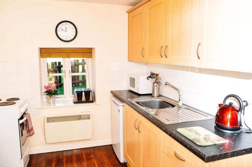 A canalside cottage, within Goytre Wharf on the Monmouthshire & Brecon Canal