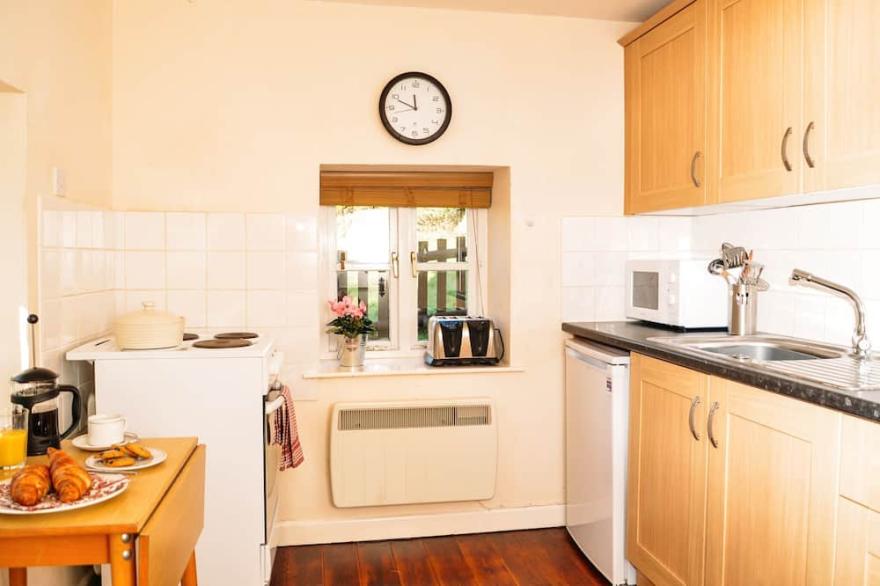 A canalside cottage, within Goytre Wharf on the Monmouthshire & Brecon Canal