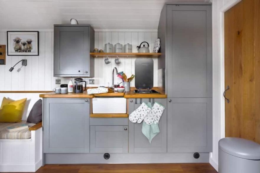This pretty shepherds hut has been designed carefully with a king-size bed