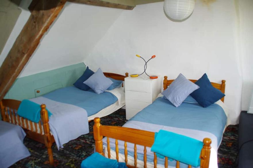 Ancient, stone cottage. Original features, modern comforts, family-friendly.