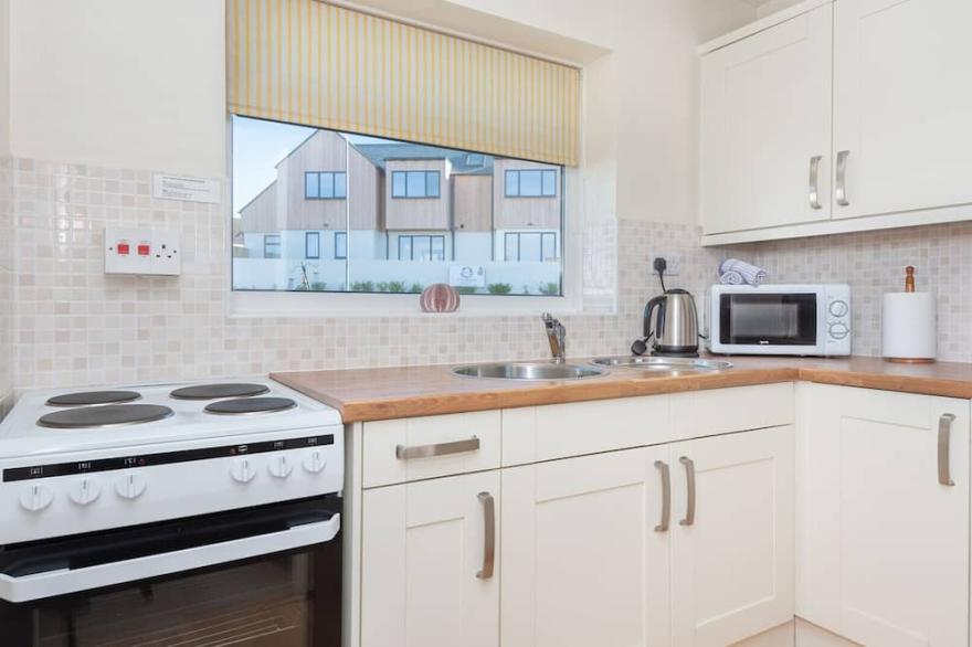 Sunnynook, a mid terrace bungalow just 500 yards from the south west coast path and sandy beaches