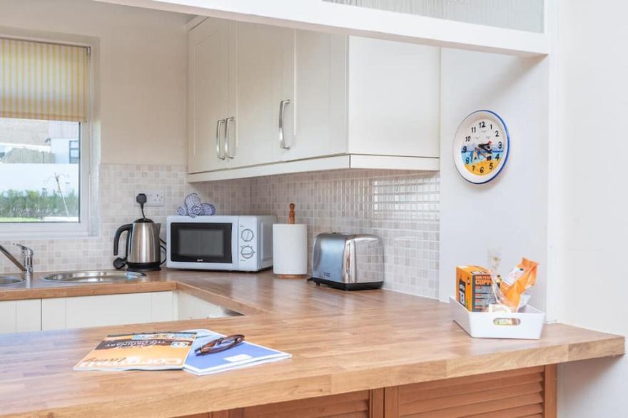 Sunnynook, a mid terrace bungalow just 500 yards from the south west coast path and sandy beaches