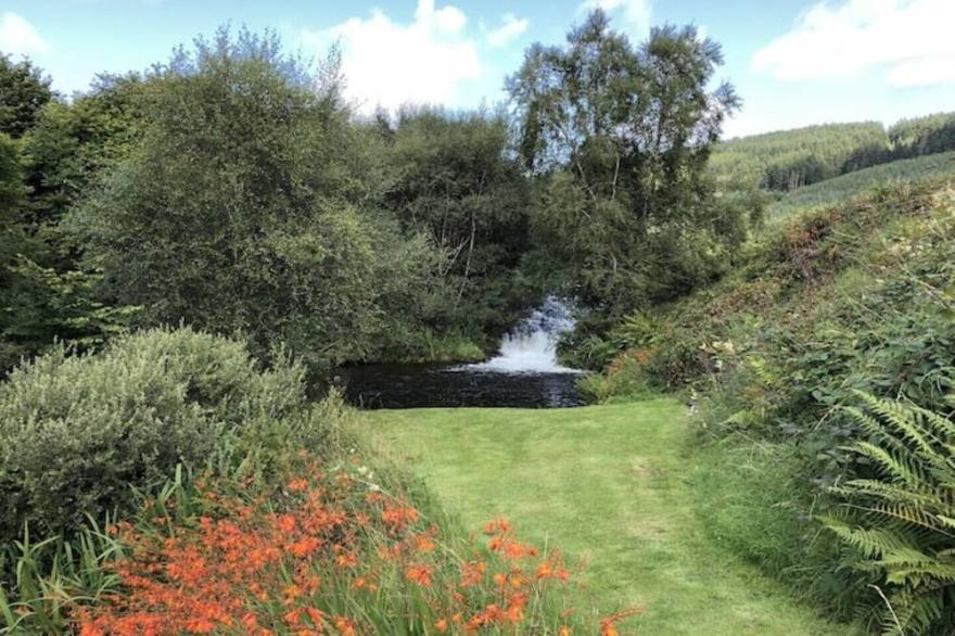 Secluded traditional Island house surrounded by river and wild flower meadows
