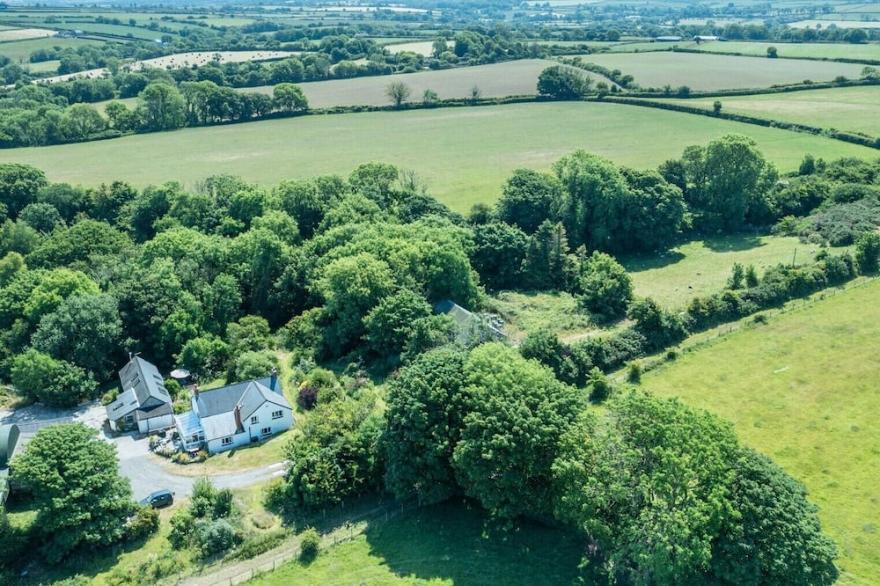 A quirky converted barn tucked away by the woods..