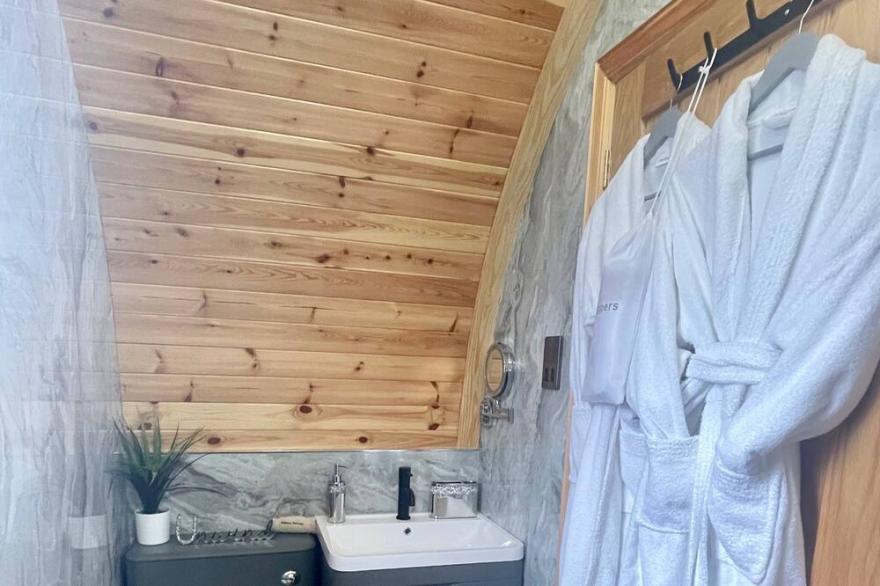 Luxury seafront glamping pod with private patio and Hydropool Jaccuzi