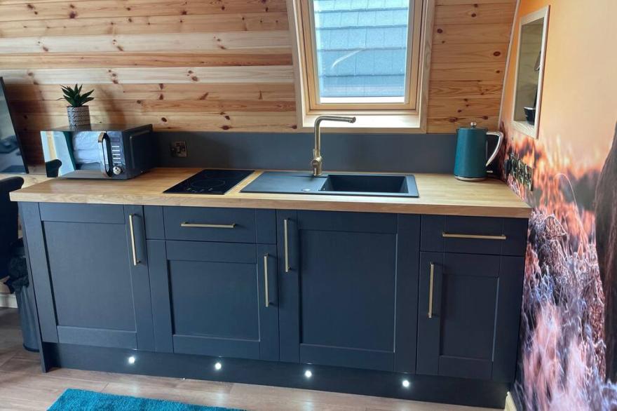 Luxury seafront glamping pod with private patio and Hydropool Jaccuzi