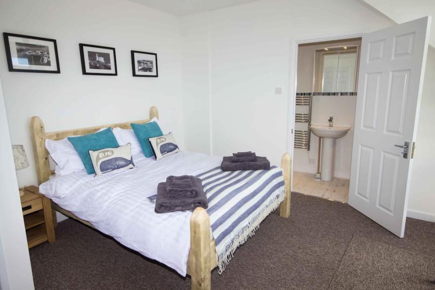 Beautiful, spacious 2 bedroom holiday house with parking and sea views.