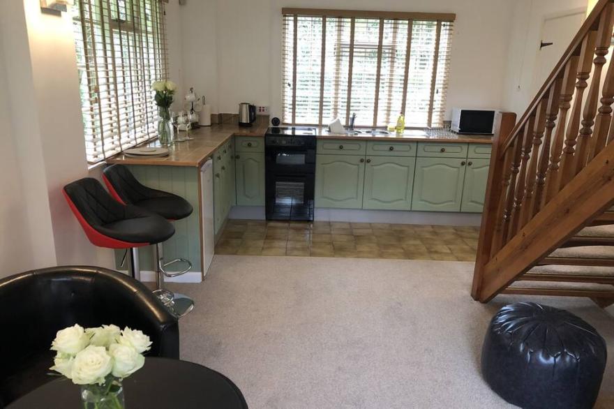 TUCKING RIVER LODGE, pet friendly, with a garden in Lynton