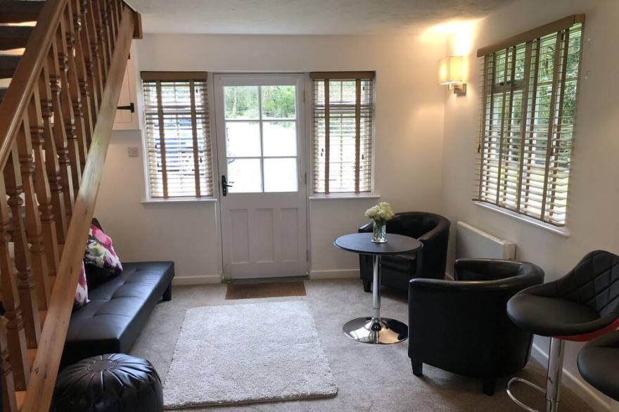 TUCKING RIVER LODGE, pet friendly, with a garden in Lynton