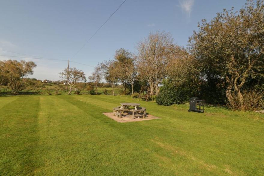 BRON GADAIR, pet friendly, character holiday cottage in Newborough