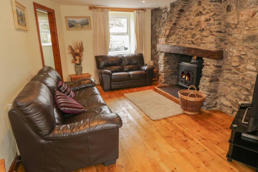 BRON GADAIR, pet friendly, character holiday cottage in Newborough