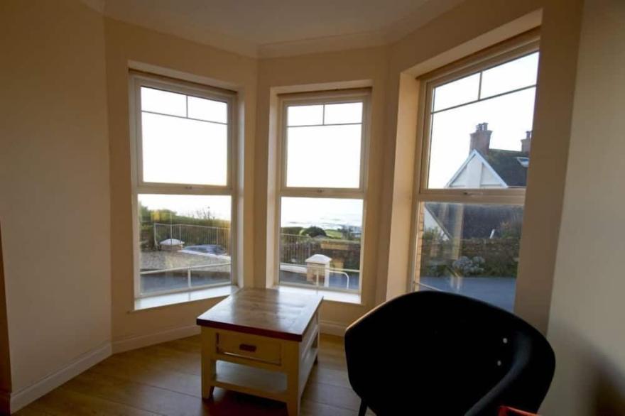 Smart 2 bed apartment opposite main beach with fab views and outside space
