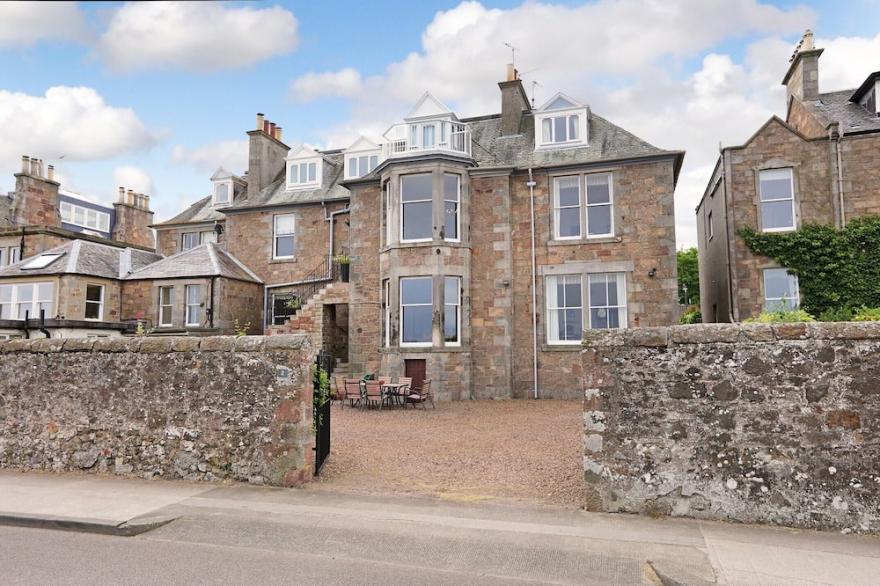 A generous, elegant front-line Victorian property with stunning sea, golf & offshore island views.