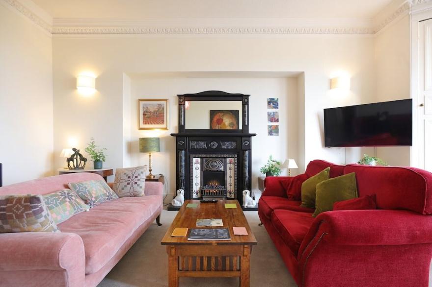 A generous, elegant front-line Victorian property with stunning sea, golf & offshore island views.
