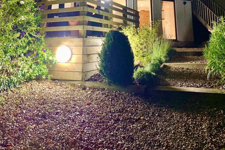 Spacious 4-bed cottage with parking, garden, & large balcony, in village centre