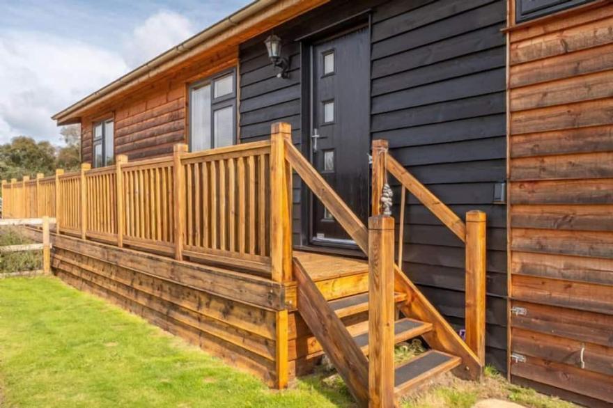 Suffolk Barn is a well-presented wooden holiday lodge, set within 300 acres of woodland and open hea