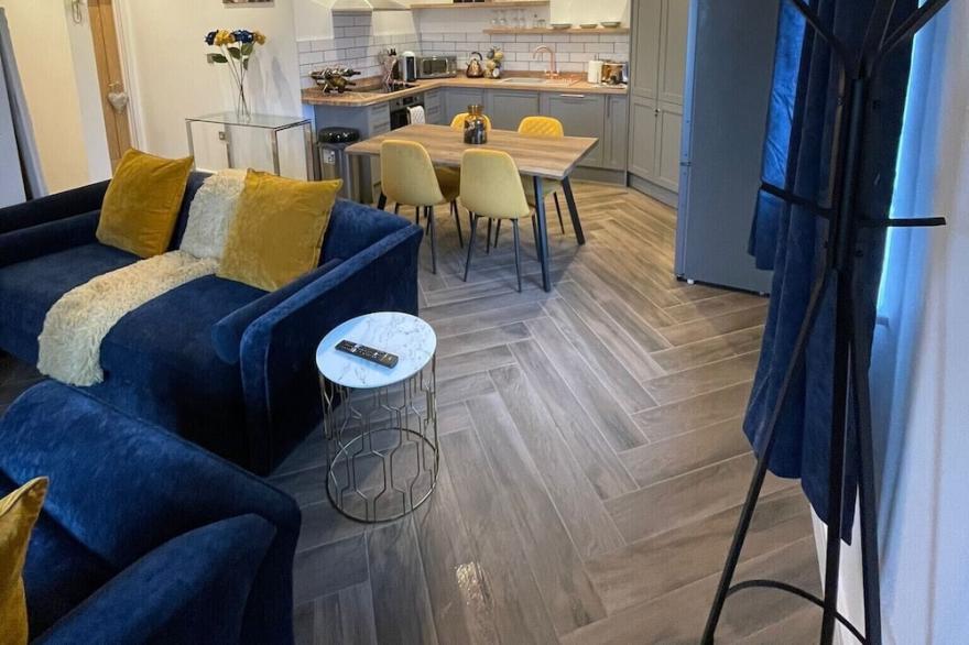 Luxury open plan kitchen, dining, lounge with 2 bedrooms and 2 bathrooms.