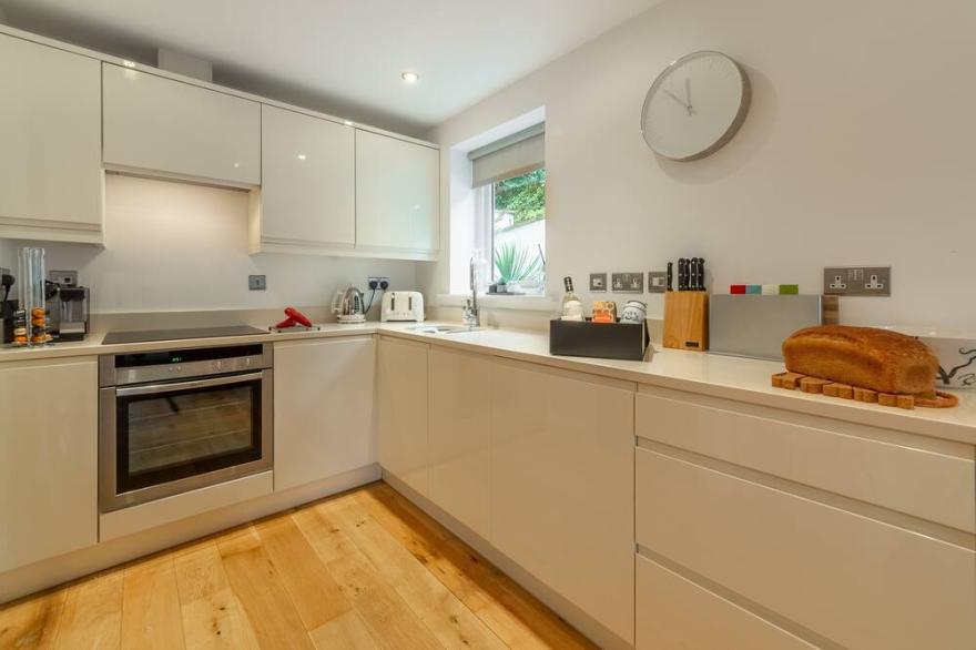A stunning ground floor apartment with a large outdoor terrace and sea views.