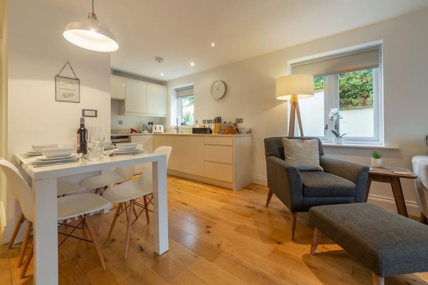 A stunning ground floor apartment with a large outdoor terrace and sea views.