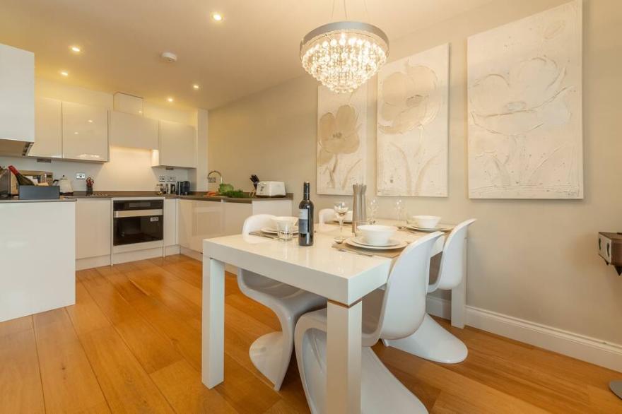 A two-bedroom modern and sleek apartment with sea views and an outdoor terrace.