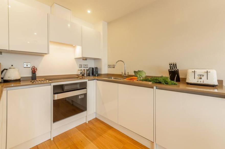A two-bedroom modern and sleek apartment with sea views and an outdoor terrace.