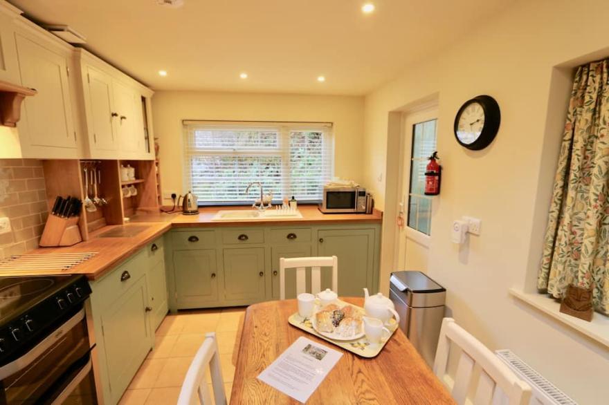 Alice's Cottage, Stands In The Beautiful Wooded Valley At Watergate