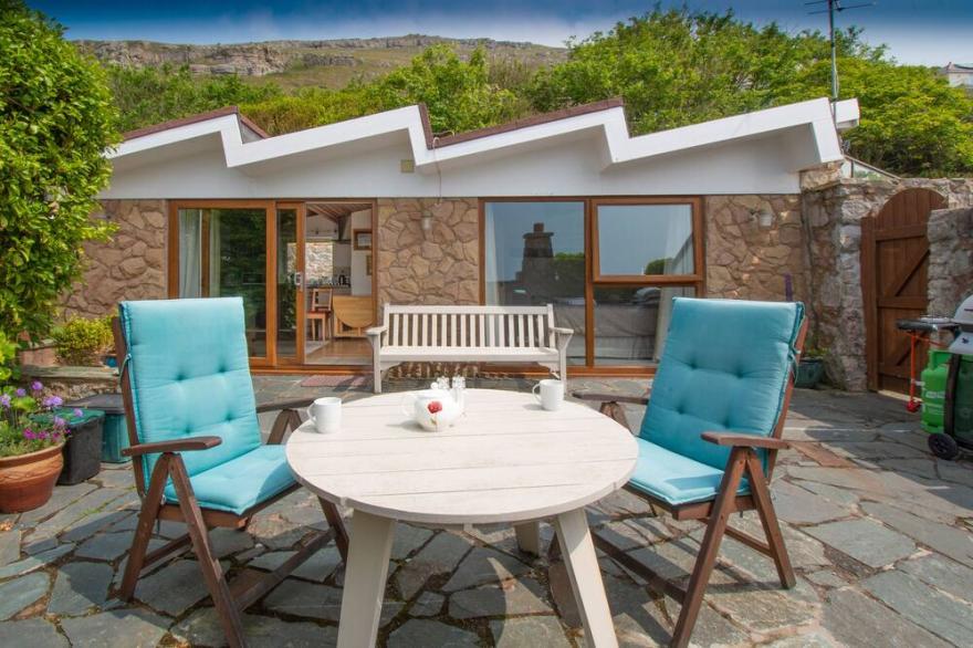 Exclusive beachside lodge with panoramic sea views and beach access.