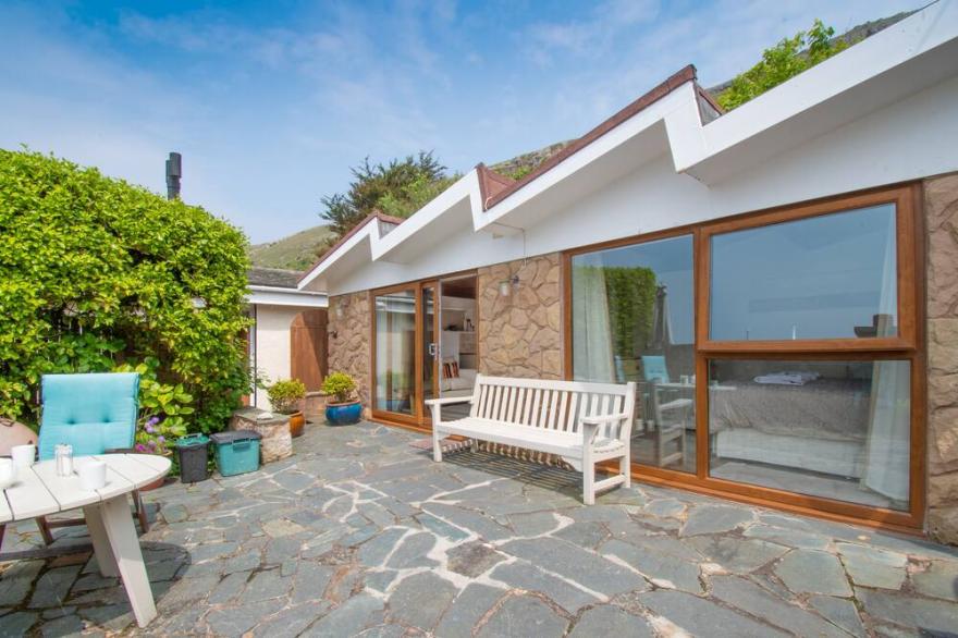 Exclusive beachside lodge with panoramic sea views and beach access.
