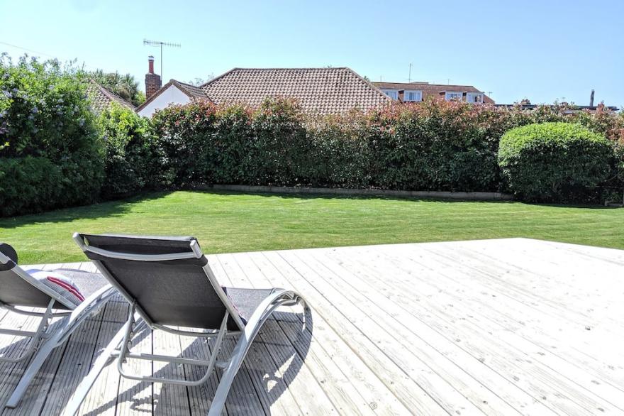 Luxury seaside home with beautiful south facing garden on private sea estate.