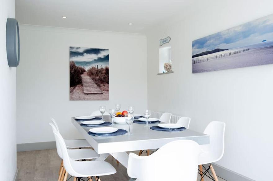 Luxury seaside home with beautiful south facing garden on private sea estate.