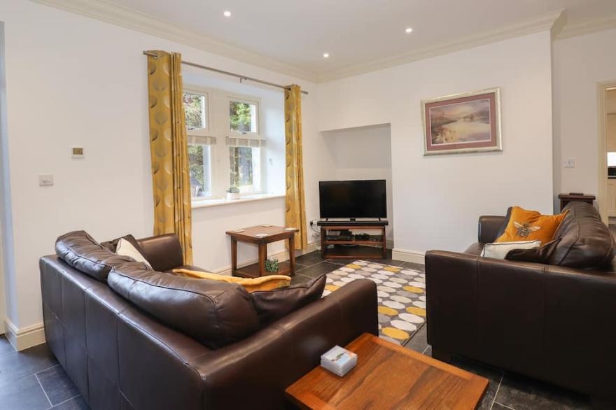 1 THE STABLES, character holiday cottage in Grange-Over-Sands