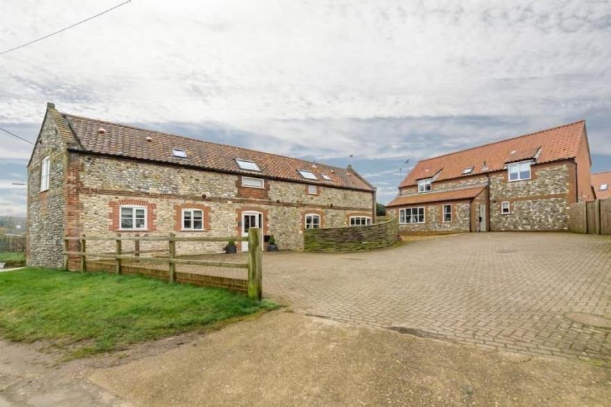 A beautifully presented contemporary four-bedroom house in an attractive village