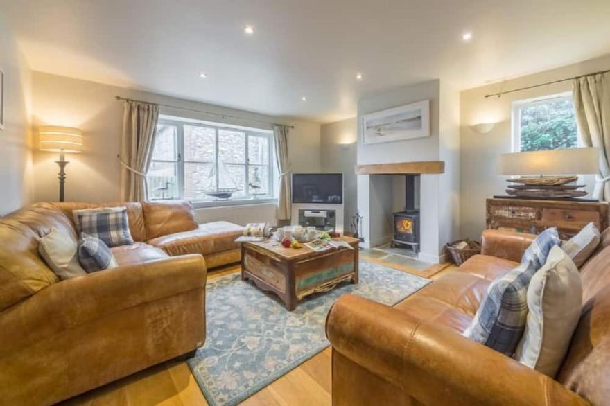 A beautifully presented contemporary four-bedroom house in an attractive village