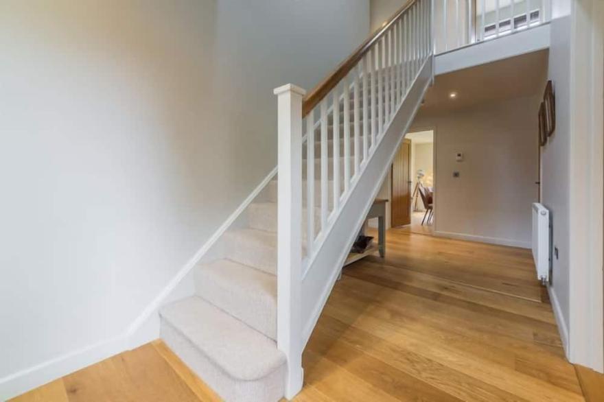 A beautifully presented contemporary four-bedroom house in an attractive village