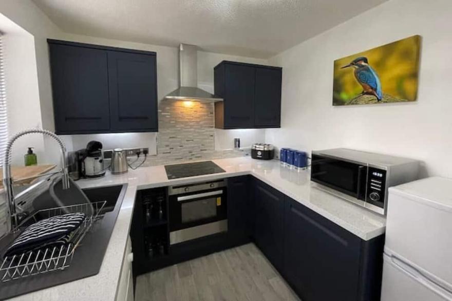 Riverside Two Bedroom Townhouse with Car Charger.