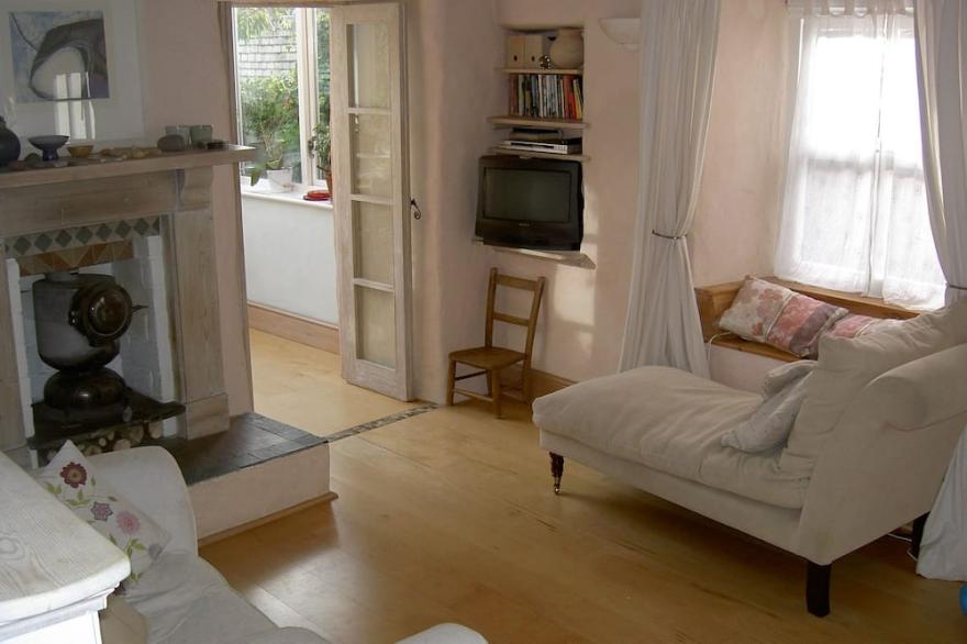 Gorgeous artist's cottage with secluded garden and sea views from all rooms.